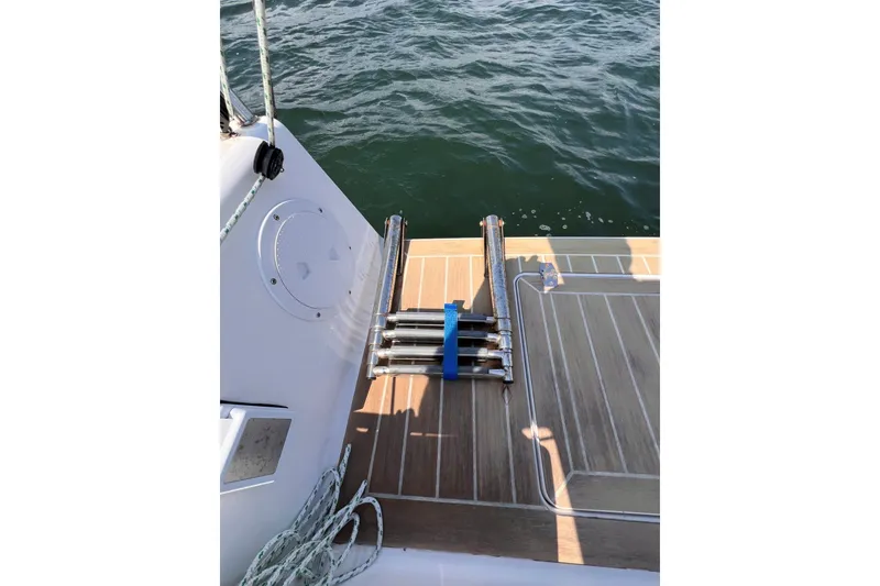 Slide: The Image of 2023 J Boats J/9 swim platform with ladder, docked on calm water. - 19
