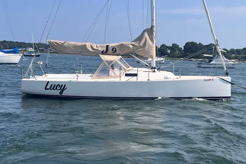 Slide: The Image of 2023 J Boats J/9 sailboat named Lucy on calm water. - 7