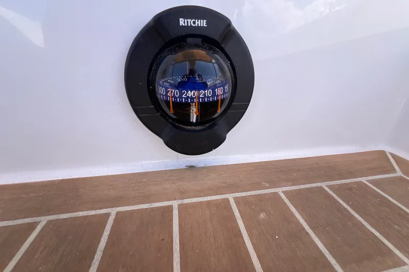Slide: The Image of Compass on 2023 J Boats J/9 yacht, mounted on wooden deck. - 28