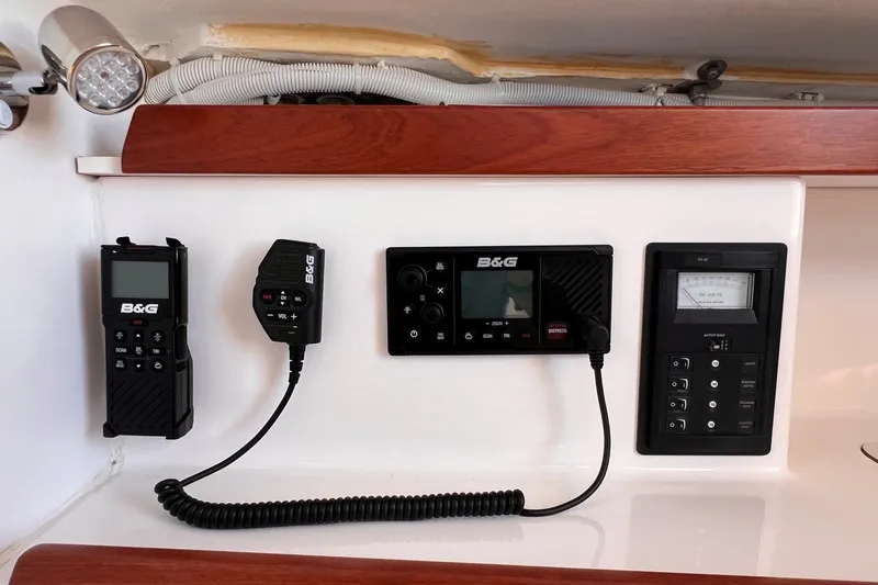 Slide: The Image of 2023 J Boats J/9 interior electronics panel with B&G communication devices. - 33