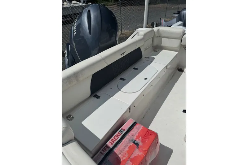 Slide: The Image of 2021 Tidewater 220 LXF boat interior with seating and Yamaha outboard motor. - 6