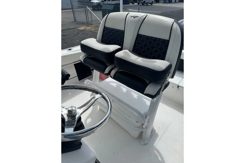Slide: The Image of 2021 Tidewater 220 LXF boat seats with stylish black and white upholstery. - 13