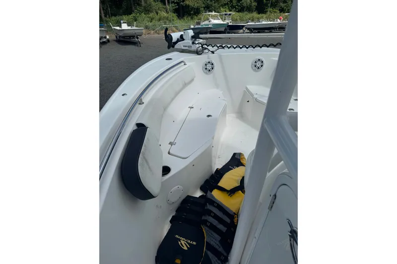 Slide: The Image of 2021 Tidewater 220 LXF boat interior with seating and life jackets. - 11
