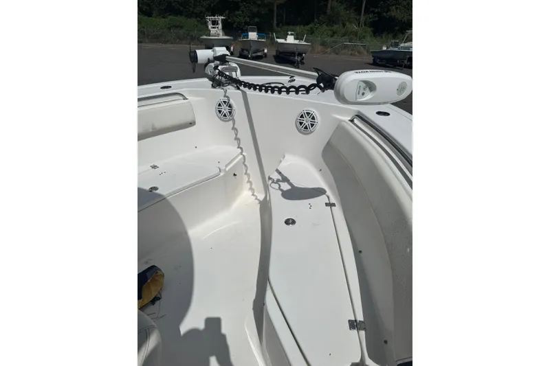 Slide: The Image of 2021 Tidewater 220 LXF boat interior with seating and speakers. - 10