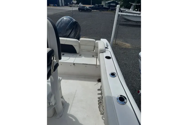 Slide: The Image of 2021 Tidewater 220 LXF boat interior with seating and rod holders. - 14