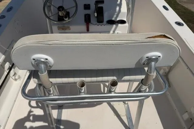 Slide: The Image of 2007 KenCraft 210 Sea King boat interior with steering wheel and rod holders. - 24