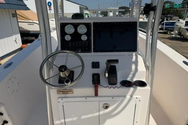 Slide: The Image of 2007 KenCraft 210 Sea King boat console with steering wheel and gauges. - 25