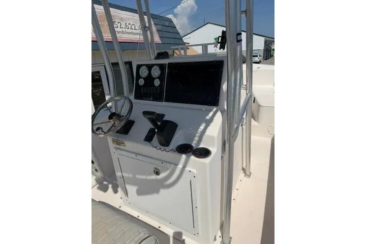 Slide: The Image of 2007 KenCraft 210 Sea King boat console with steering wheel and gauges. - 28