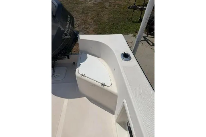 Slide: The Image of 2007 KenCraft 210 Sea King boat deck with Yamaha motor, outdoor setting. - 23