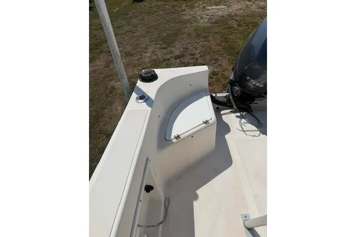 Slide: The Image of 2007 KenCraft 210 Sea King boat interior with motor and seating area. - 18