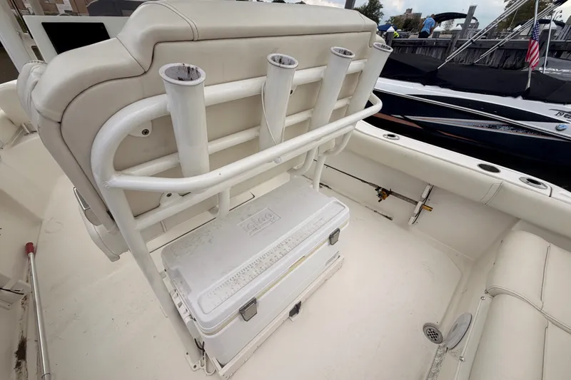 Slide: The Image of 2021 Key West 219 FS boat interior with rod holders and cooler. - 15