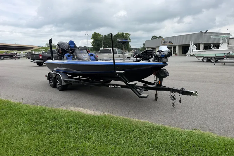 Slide: The Image of 2022 Falcon F20 boat on trailer in parking lot, cloudy sky background. - 4