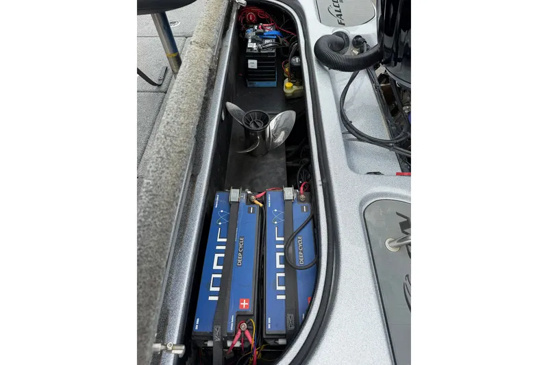 Slide: The Image of 2022 Falcon F20 boat battery compartment with deep cycle batteries and wiring. - 12