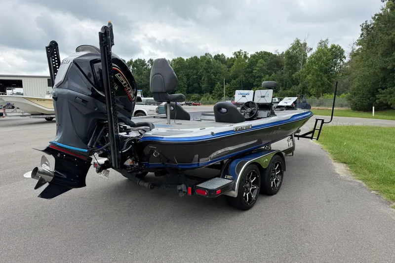 Slide: The Image of 2022 Falcon F20 boat on trailer, featuring powerful engine and sleek design. - 6
