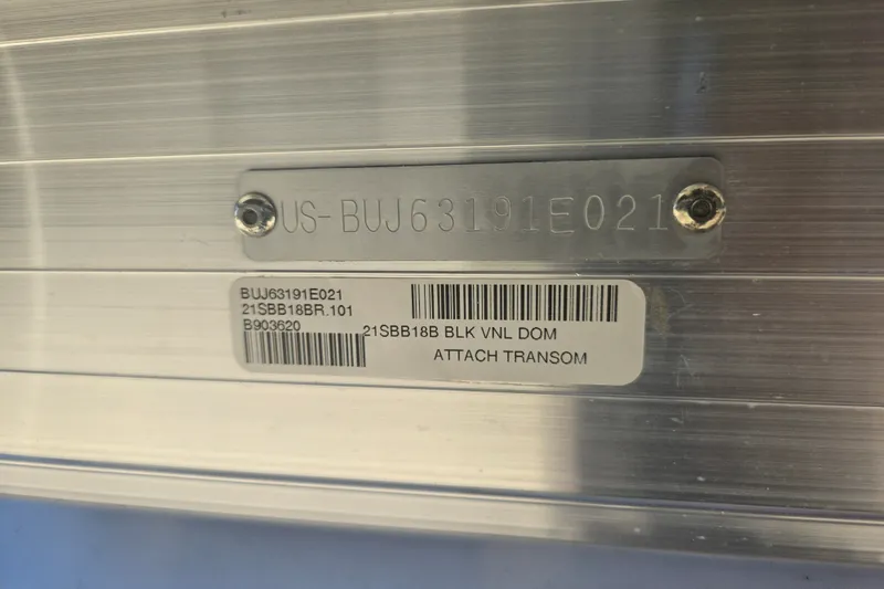 Slide: The Image of 2021 Sun Tracker Bass Buggy 18 DLX serial number plate with barcode and transom attachment. - 22