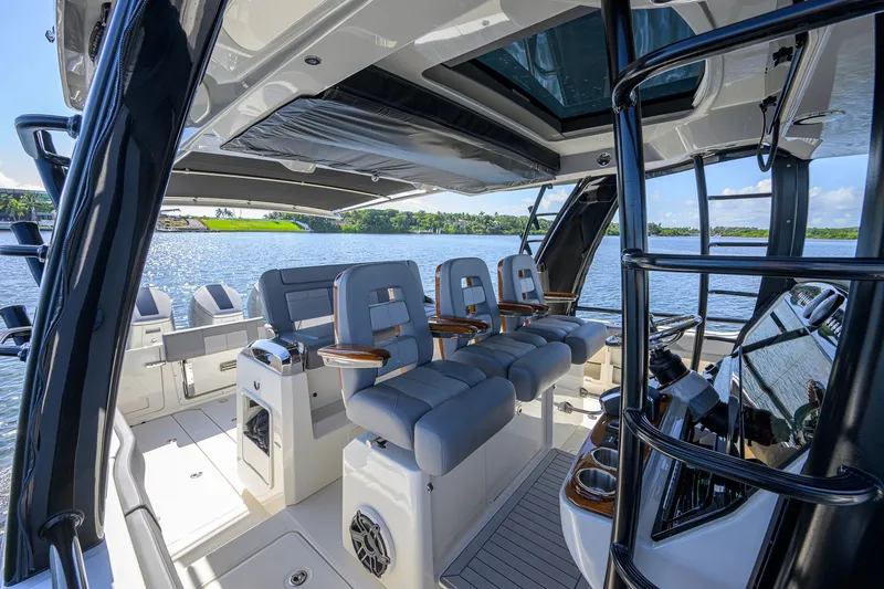 Slide: The Image of Luxurious interior of 2024 Boston Whaler 42 OUTRAGE boat with plush seating and modern design. - 54