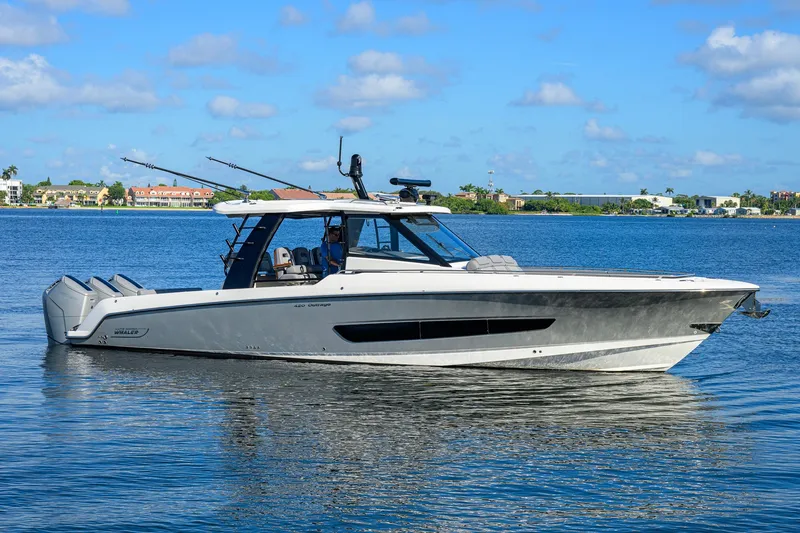 Slide: The Image of 2024 Boston Whaler 42 OUTRAGE boat on calm water, clear sky background. - 60