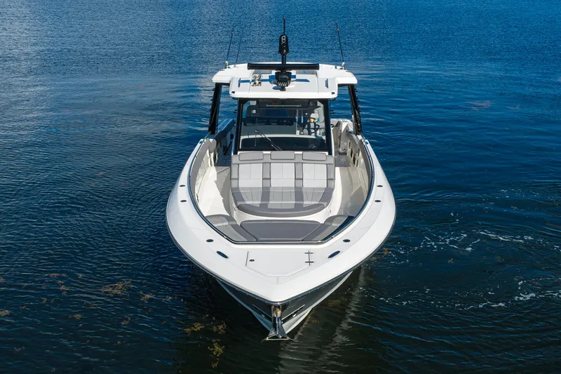 Slide: The Image of 2024 Boston Whaler 42 OUTRAGE boat on calm water, front view. - 71