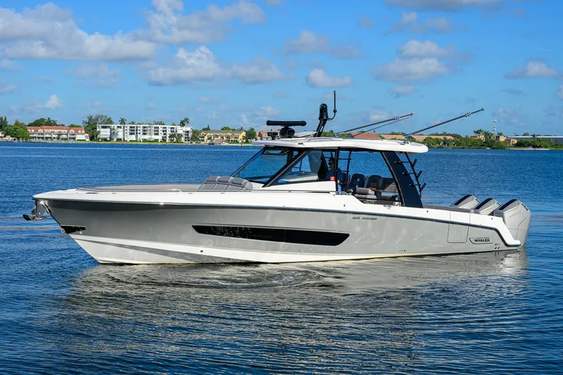 Slide: The Image of 2024 Boston Whaler 42 OUTRAGE boat cruising on a sunny day. - 64