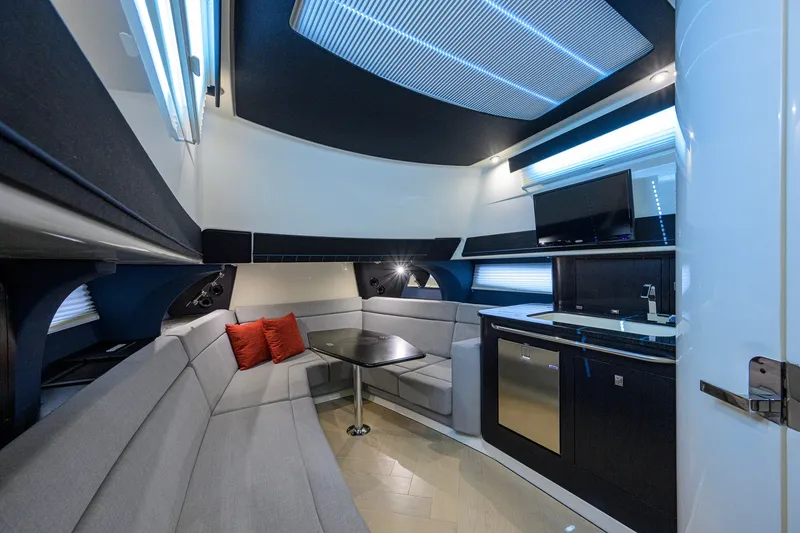 Slide: The Image of Luxurious interior of 2024 Boston Whaler 42 OUTRAGE with modern seating and kitchenette. - 17