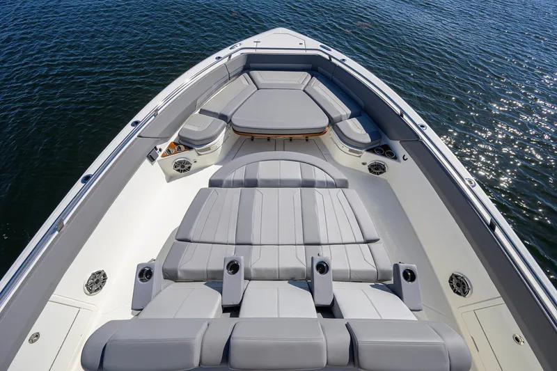 Slide: The Image of 2024 Boston Whaler 42 OUTRAGE boat with luxurious seating on calm water. - 5