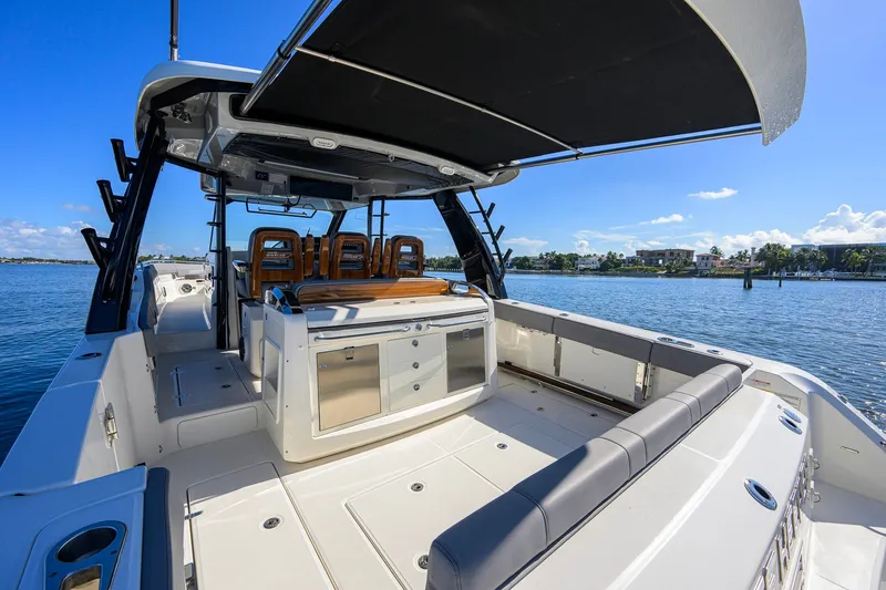 Slide: The Image of 2024 Boston Whaler 42 OUTRAGE boat interior with seating and ocean view. - 44