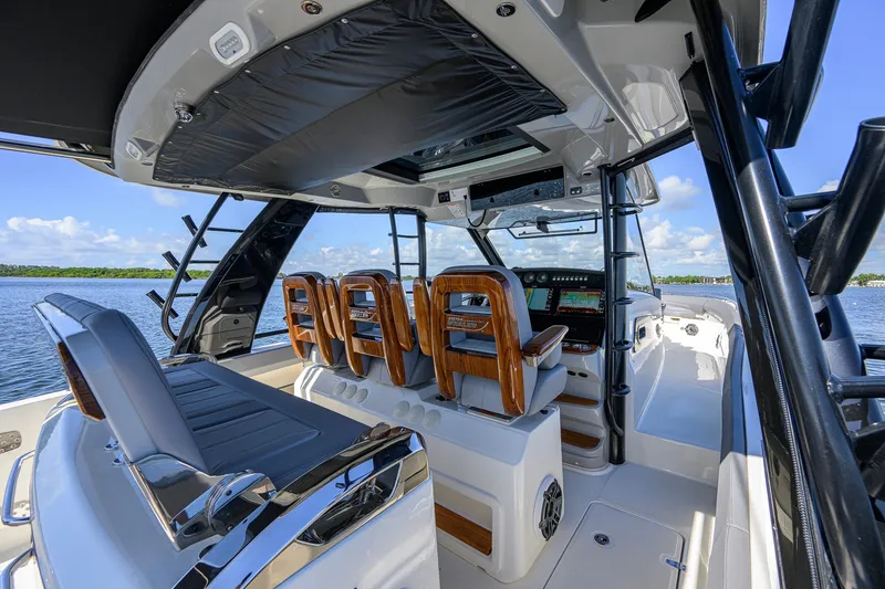 Slide: The Image of Interior view of 2024 Boston Whaler 42 OUTRAGE boat with luxurious seating and advanced controls. - 51