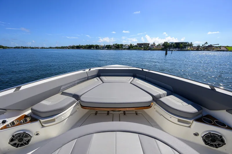 Slide: The Image of 2024 Boston Whaler 42 OUTRAGE boat interior with luxurious seating on a sunny day. - 6