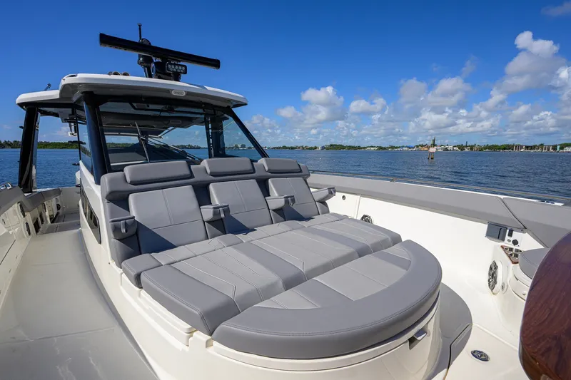 Slide: The Image of 2024 Boston Whaler 42 OUTRAGE boat with luxurious seating on a sunny day. - 16