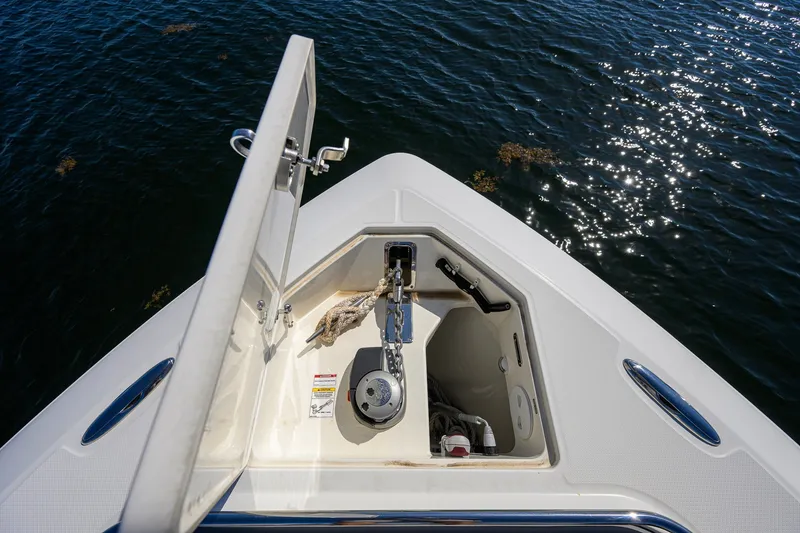 Slide: The Image of Anchor compartment of 2024 Boston Whaler 42 OUTRAGE, open on calm water. - 7