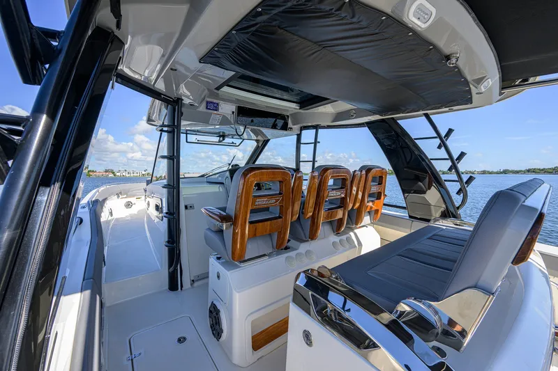 Slide: The Image of 2024 Boston Whaler 42 OUTRAGE interior with luxurious seating and modern design. - 47