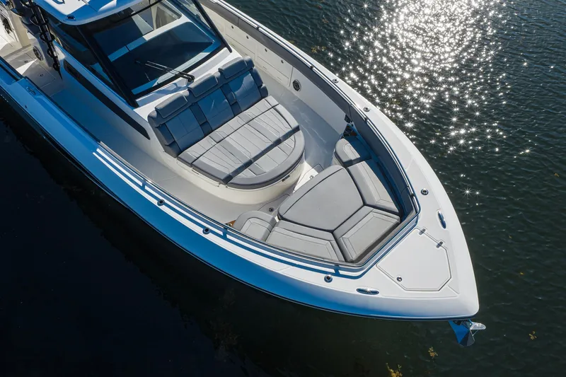 Slide: The Image of 2024 Boston Whaler 42 OUTRAGE boat with sleek design on sparkling water. - 1