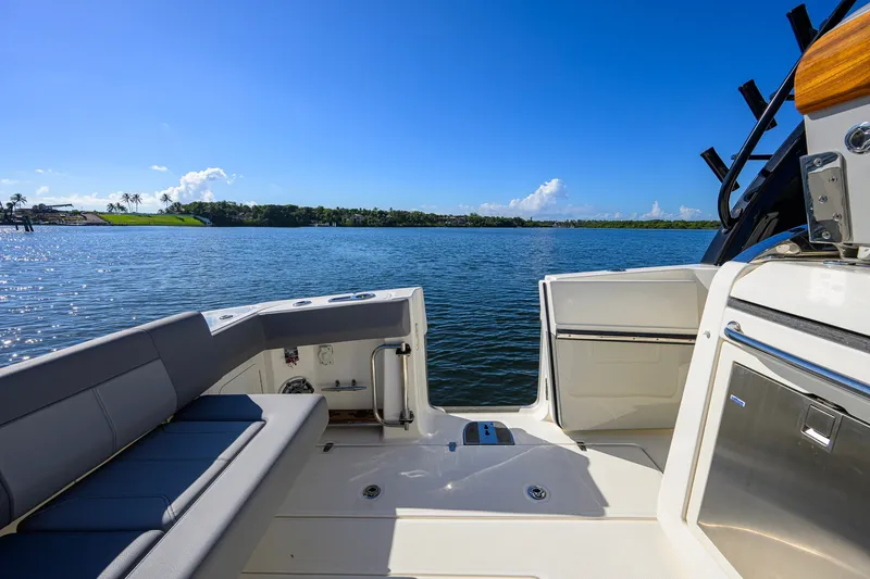 Slide: The Image of 2024 Boston Whaler 42 OUTRAGE boat interior with scenic water view. - 31