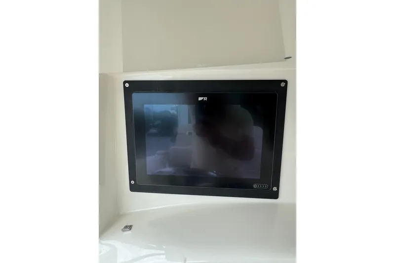 Slide: The Image of Touchscreen display on a 2005 Boston Whaler Outrage 320 boat dashboard. - 18