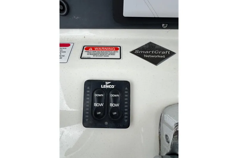 Slide: The Image of Control panel of a 2005 Boston Whaler Outrage 320 boat with Lenco switches. - 20