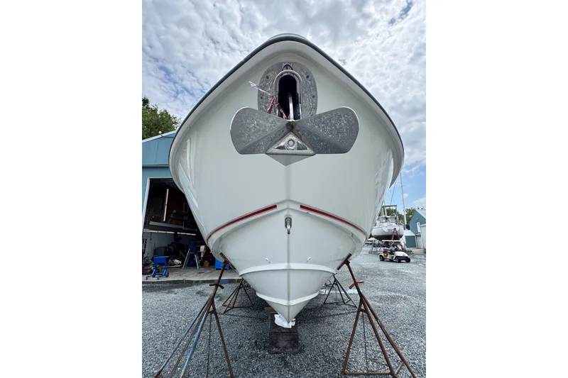 Slide: The Image of 2005 Boston Whaler Outrage 320 boat on stands, viewed from the front. - 1