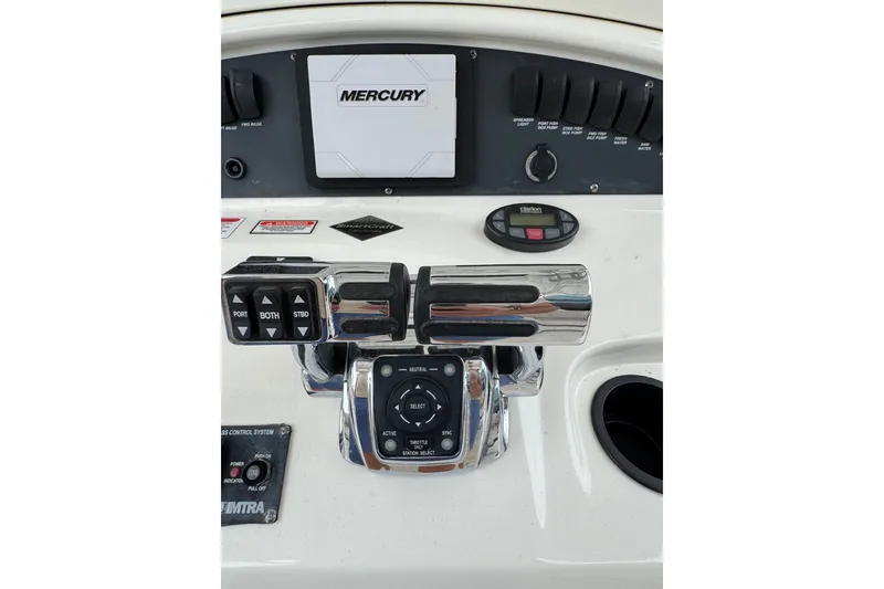 Slide: The Image of Control panel of a 2005 Boston Whaler Outrage 320 boat with Mercury throttle. - 21