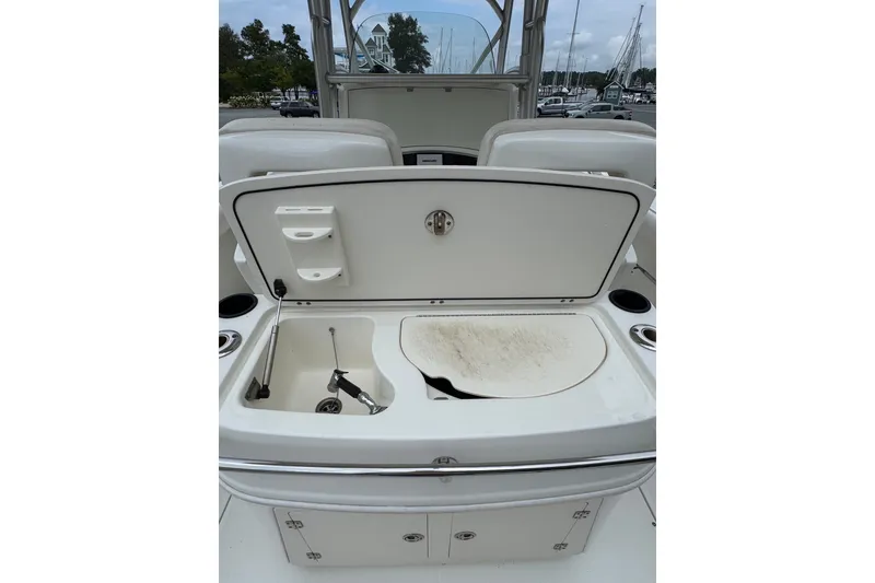 Slide: The Image of 2005 Boston Whaler Outrage 320 boat interior with open storage compartment. - 15