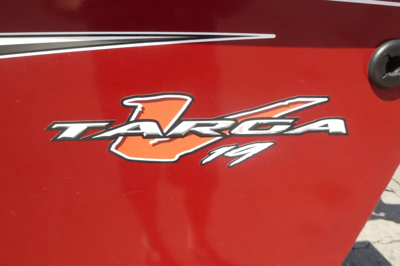 Slide: The Image of Red Tracker Targa V-19 Combo 2021 logo on boat exterior. - 18