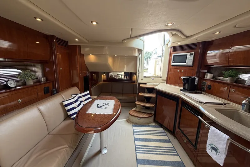 Slide: The Image of Luxurious interior of 2004 Sea Ray 390 Sundancer yacht with modern amenities and elegant design. - 31