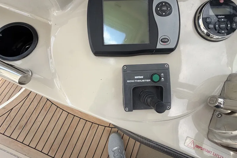 Slide: The Image of Control panel of a 2004 Sea Ray 390 Sundancer boat with navigation and bow thruster controls. - 15
