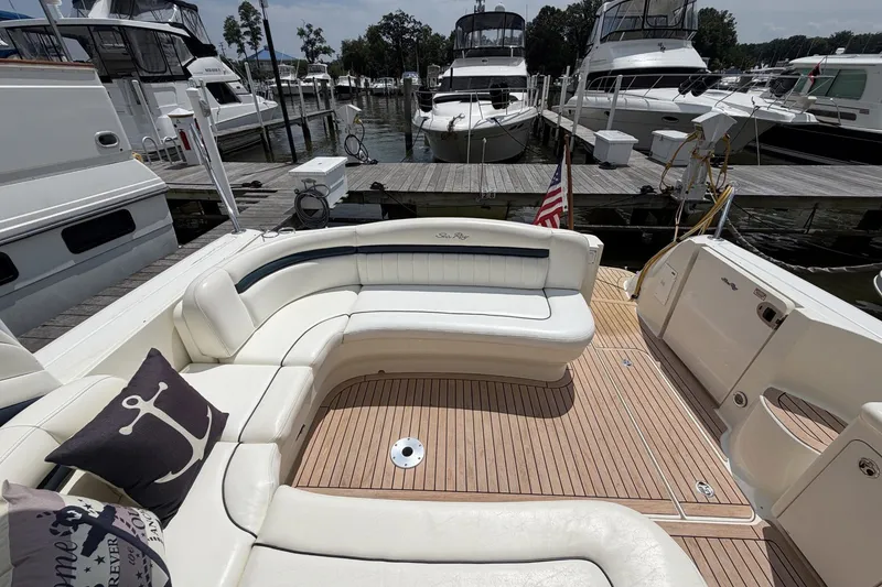 Slide: The Image of Luxurious 2004 Sea Ray 390 Sundancer yacht with spacious seating at marina dock. - 7