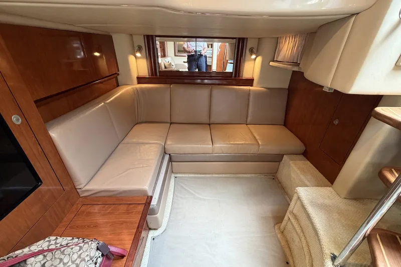 Slide: The Image of Luxurious interior of a 2004 Sea Ray 390 Sundancer yacht with beige leather seating. - 32
