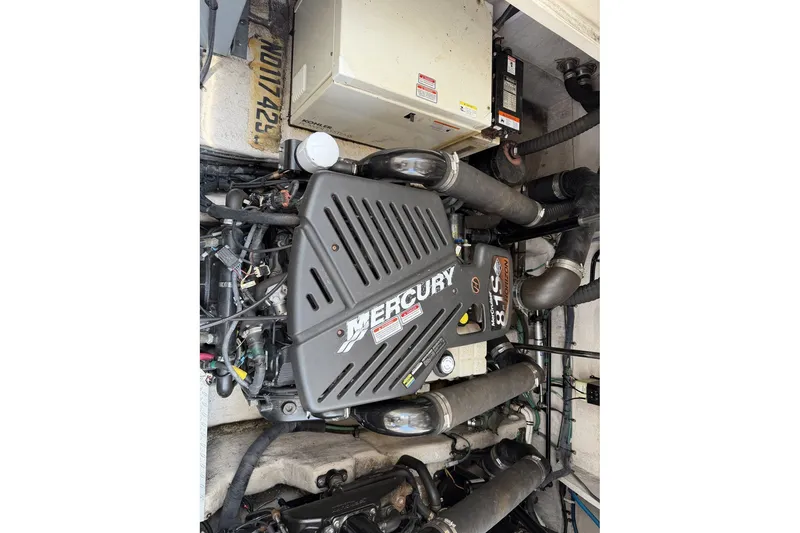 Slide: The Image of Engine compartment of a 2004 Sea Ray 390 Sundancer with Mercury engine. - 44