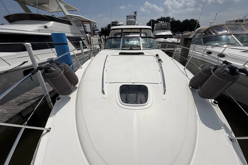 Slide: The Image of 2004 Sea Ray 390 Sundancer yacht docked at marina, sunny day. - 23