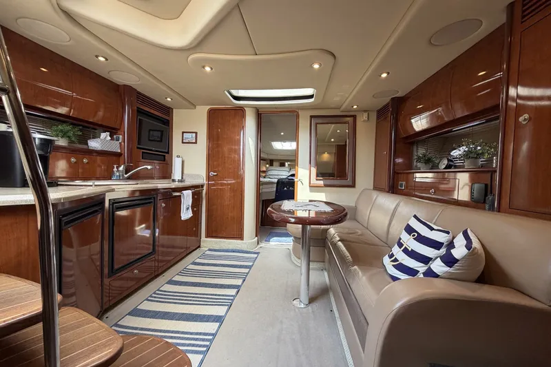 Slide: The Image of Luxurious interior of a 2004 Sea Ray 390 Sundancer yacht with elegant wood finishes. - 30