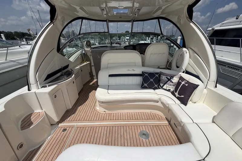 Slide: The Image of Luxurious 2004 Sea Ray 390 Sundancer yacht interior with plush seating and elegant design. - 5
