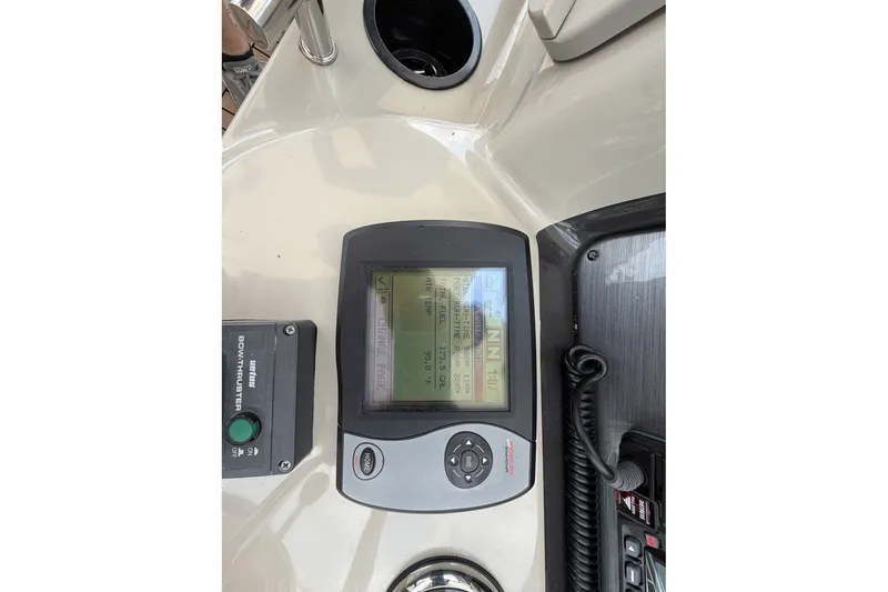Slide: The Image of Control panel of a 2004 Sea Ray 390 Sundancer boat, featuring navigation and bow thruster controls. - 19