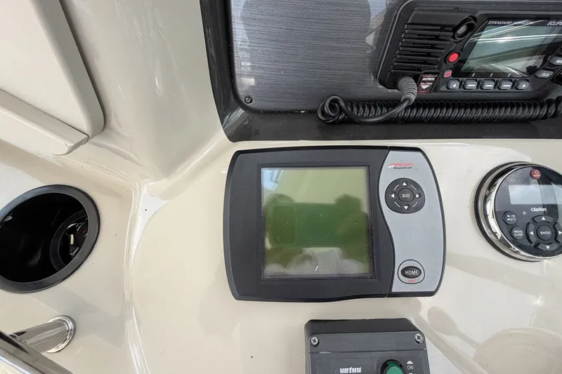 Slide: The Image of Control panel of a 2004 Sea Ray 390 Sundancer boat with navigation equipment. - 18