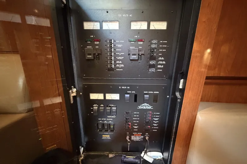 Slide: The Image of Electrical control panel inside a 2004 Sea Ray 390 Sundancer yacht. - 41